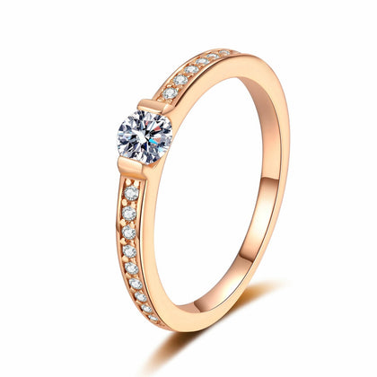 Round Moissanite Ring with CZ in champagne gold-plated S925 sterling silver on clean white background