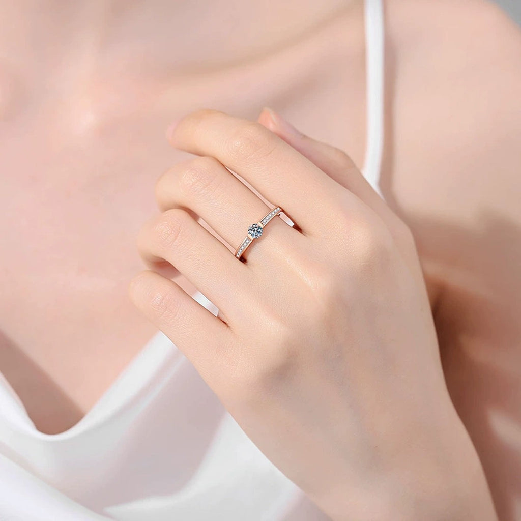 Round Moissanite Ring with CZ worn on hand to show scale, band width, and ring profile