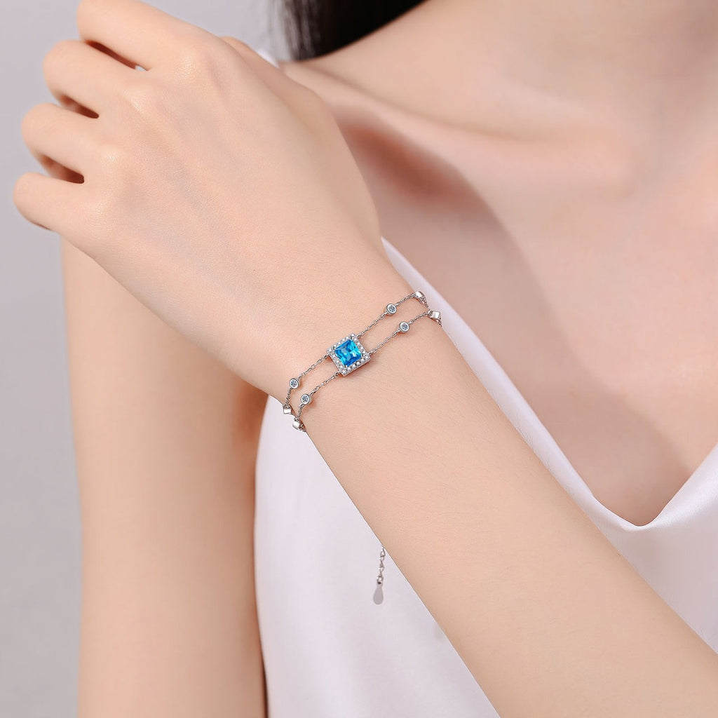 Princess Moissanite Charm Bracelet with CZ in Rhodium-Plated S925 sterling silver worn on wrist model view showing scale and adjustable fit