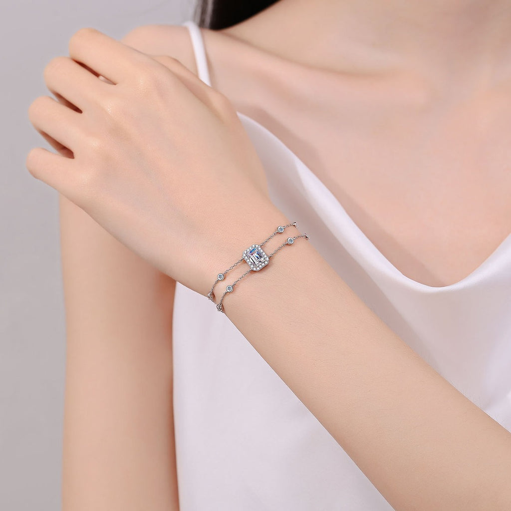 Emerald and Radiant Moissanite Charm Bracelet with CZ in Rhodium-Plated S925 sterling silver worn on wrist model view showing scale and adjustable fit