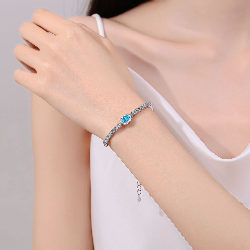 Oval and Round Moissanite Tennis Bracelet with CZ in Rhodium-Plated S925 sterling silver worn on wrist model view showing scale and adjustable fit