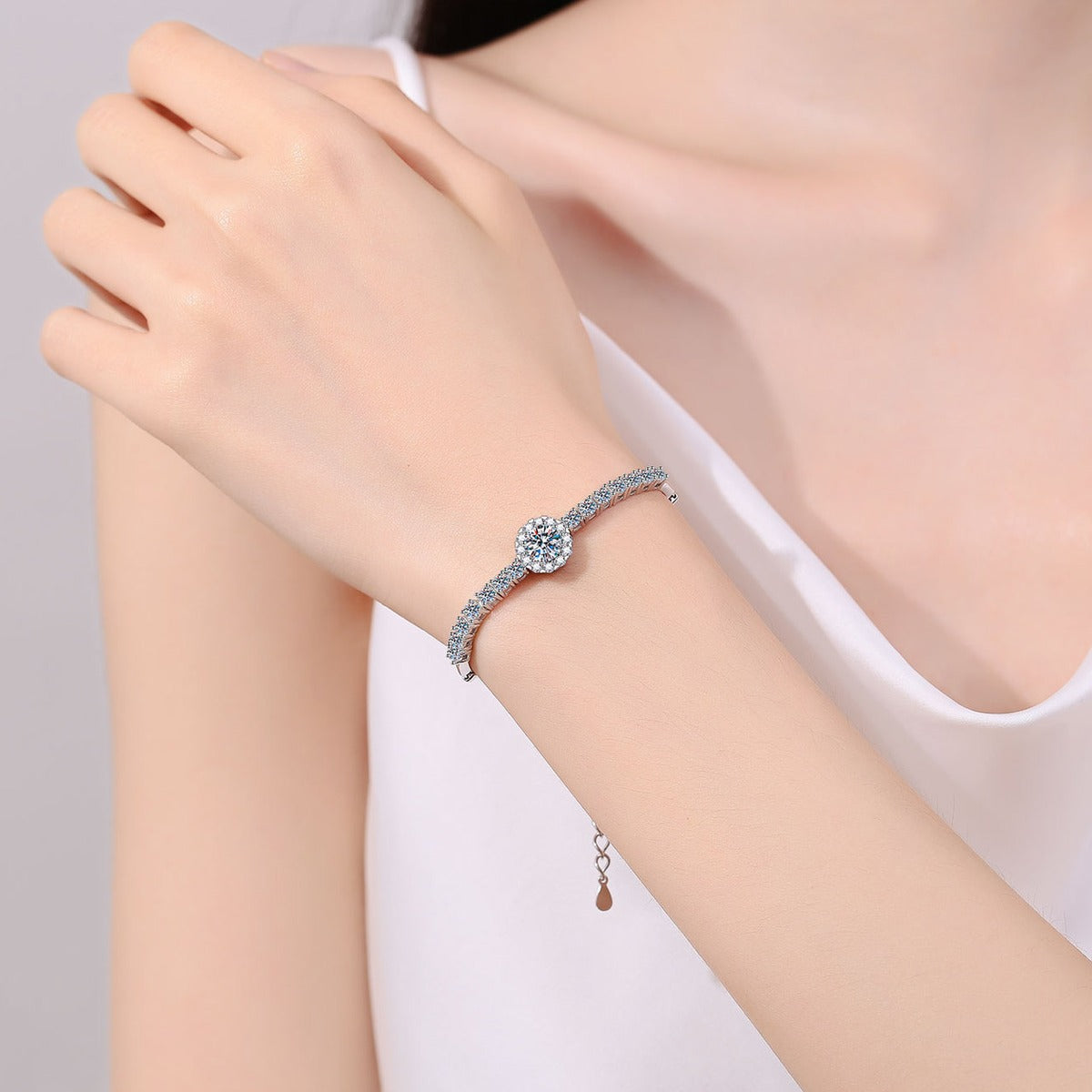 Round Moissanite Tennis Bracelet with CZ in Rhodium-Plated S925 sterling silver worn on wrist model view showing scale and adjustable fit