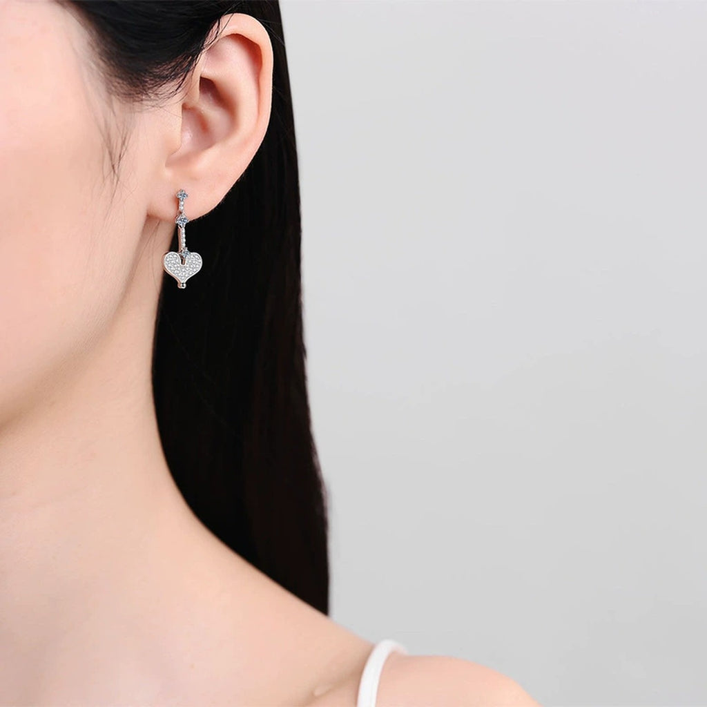 Heart Moissanite Stud Dangle Earrings in Gold-Plated S925 sterling silver worn on ear by model showing scale, placement, and stud dangle earrings styling