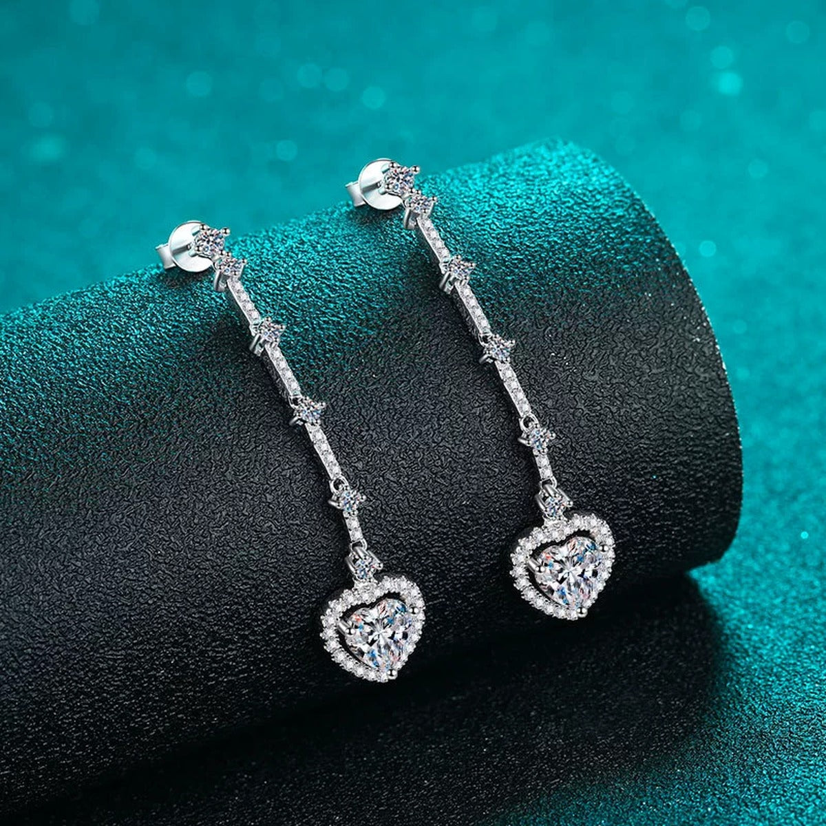 Heart Moissanite Stud Dangle Earrings with CZ in Rhodium-Plated S925 sterling silver product scene view showing angled setting detail
