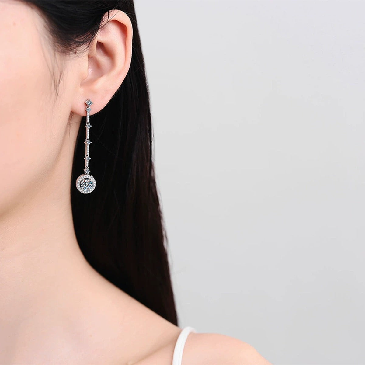 Round Moissanite Stud Dangle Earrings with CZ in Rhodium-Plated S925 sterling silver worn on ear by model showing scale, placement, and stud dangle earrings styling