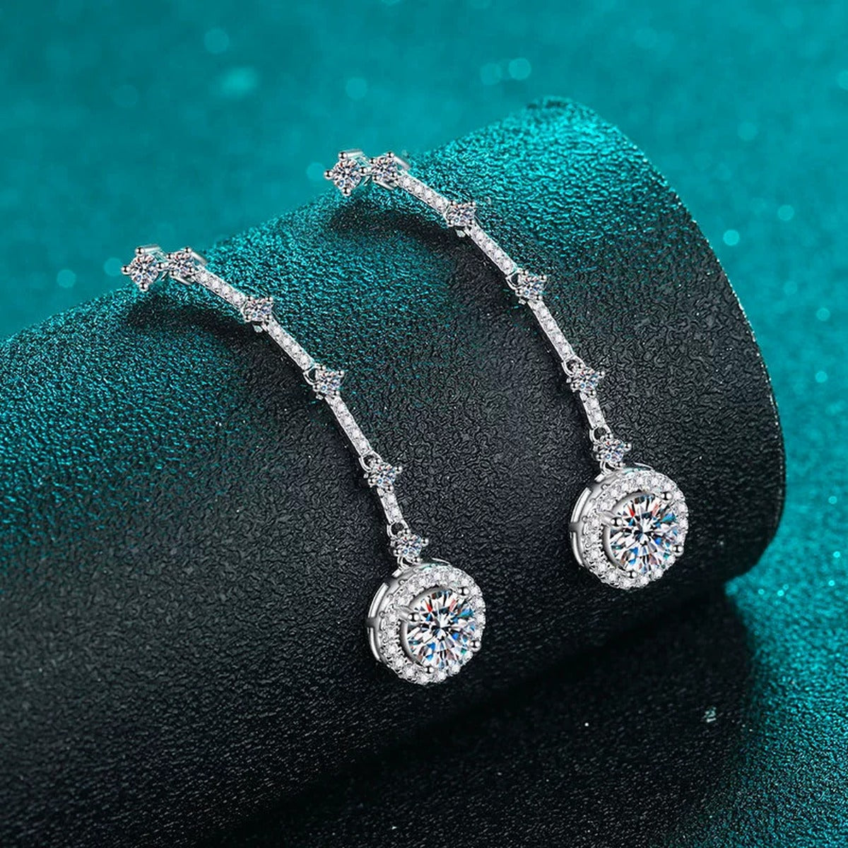 Round Moissanite Stud Dangle Earrings with CZ in Rhodium-Plated S925 sterling silver product scene view showing angled setting detail