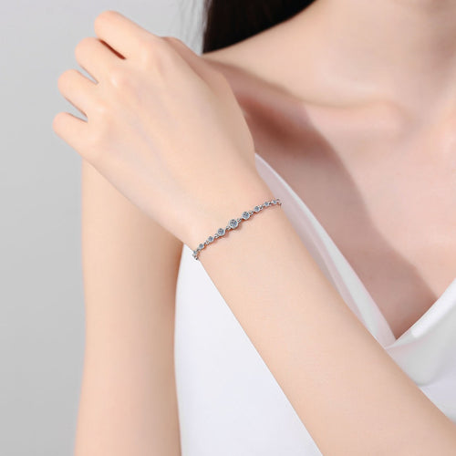 Beaded Round Moissanite Tennis Bracelet in Rhodium and Champion Gold-Plated S925 sterling silver worn on wrist model view showing scale and adjustable fit