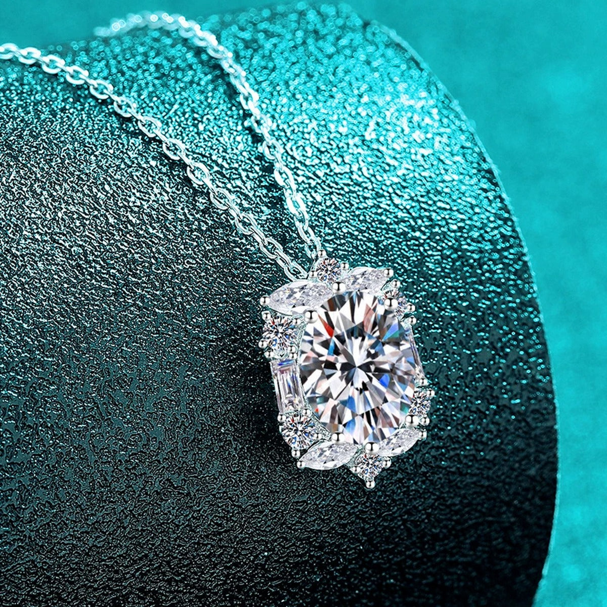 Vintage Oval Halo Moissanite Pendant Necklace with CZ in Rhodium-Plated S925 sterling silver blue display scene showing chain and stone layout