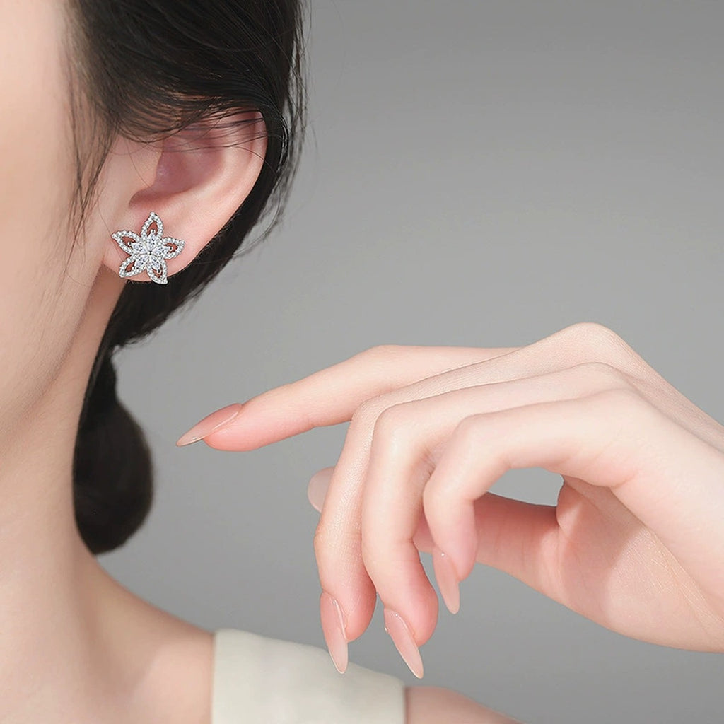 Floral Marquise Moissanite Stud Earrings in Rhodium-Plated S925 sterling silver worn on ear by model showing scale, placement, and stud earrings styling