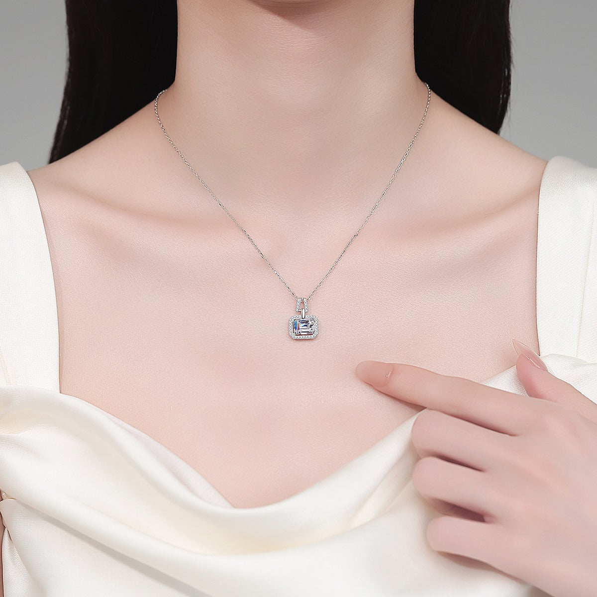 Emerald and Radiant Cut Moissanite Pendant Necklace with CZ in Rhodium-Plated S925 sterling silver neckline model view showing pendant scale and adjustable chain