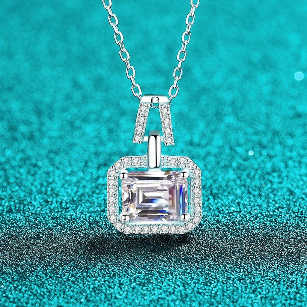 Emerald and Radiant Cut Moissanite Pendant Necklace with CZ in Rhodium-Plated S925 sterling silver blue display scene showing chain and stone layout