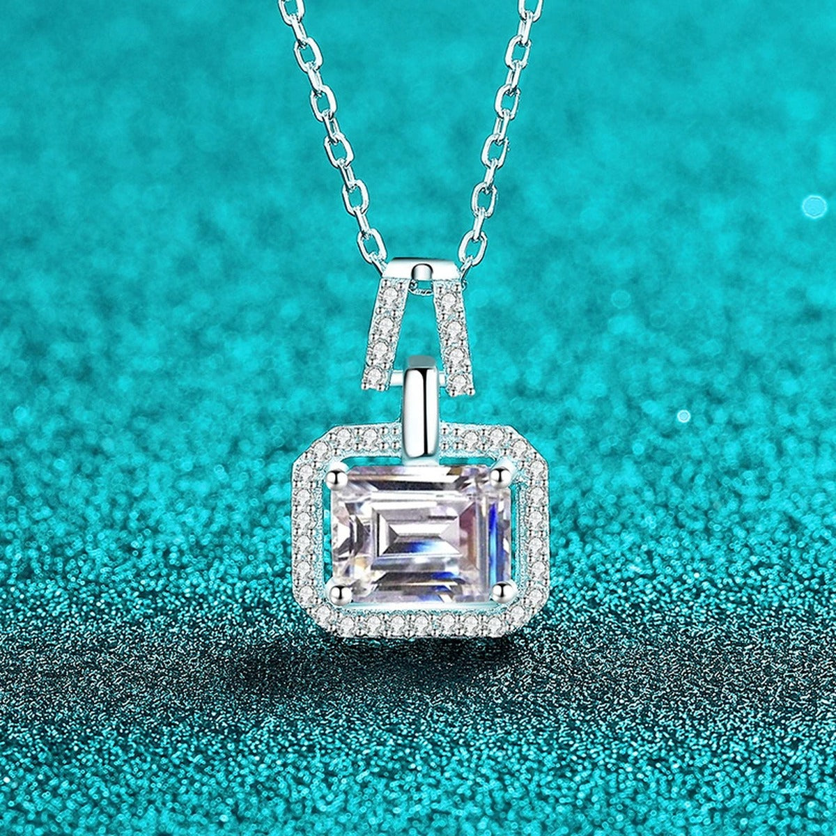 Emerald and Radiant Cut Moissanite Pendant Necklace with CZ in Rhodium-Plated S925 sterling silver blue display scene showing chain and stone layout
