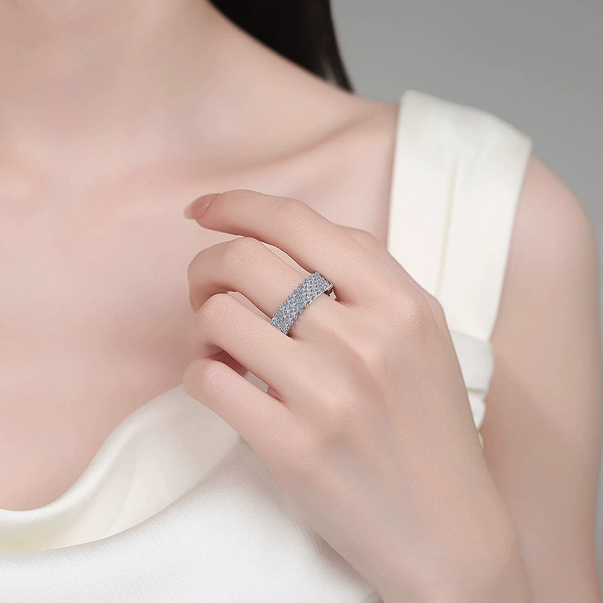 Round and Emerald Moissanite Eternity Band Ring worn on hand to show scale, band width, and ring profile