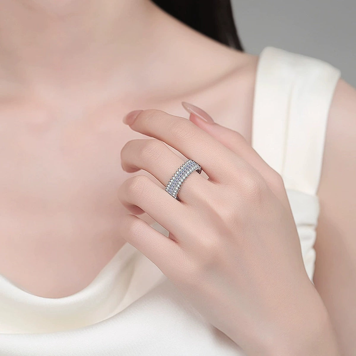 Round and Emerald Moissanite Eternity Band Ring worn on hand to show scale, band width, and ring profile