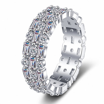 Emerald and Round Moissanite Eternity Band Ring in rhodium-plated S925 sterling silver on clean white background