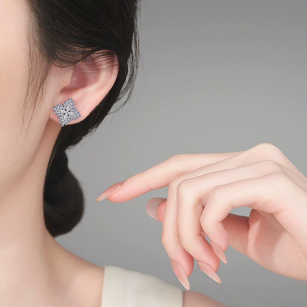 Mixed Cut Moissanite Cluster Stud Earrings in Rhodium-Plated S925 sterling silver worn on ear by model showing scale, placement, and stud earrings styling