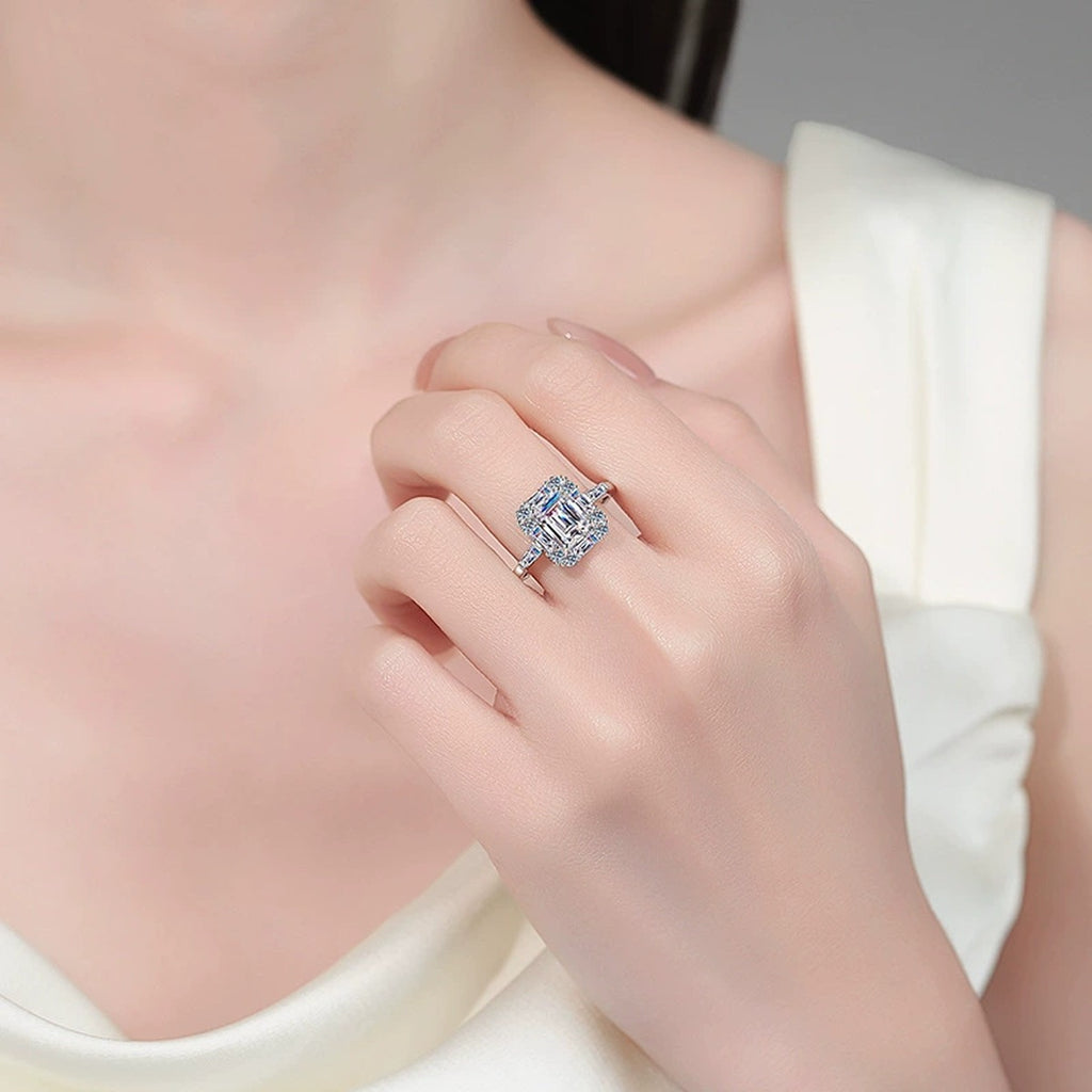 Emerald and Radiant Cut Moissanite Ring with CZ worn on hand to show scale, band width, and ring profile