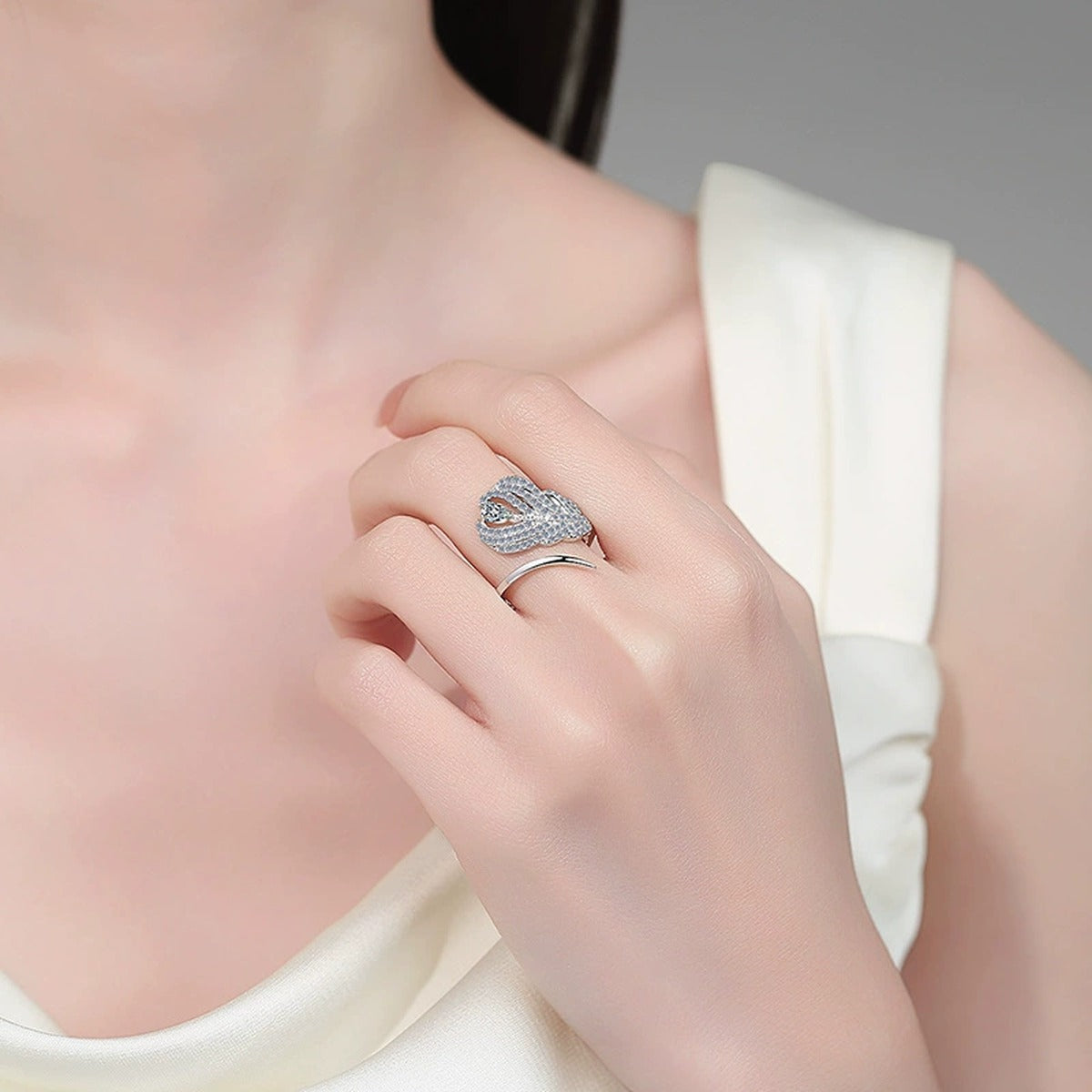 Pear and Round Moissanite Statement Ring worn on hand to show scale, band width, and ring profile