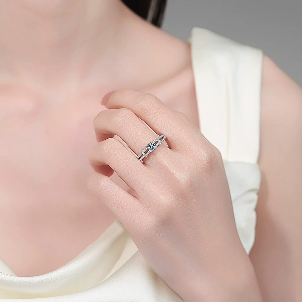 Round Moissanite Ring with CZ worn on hand to show scale, band width, and ring profile
