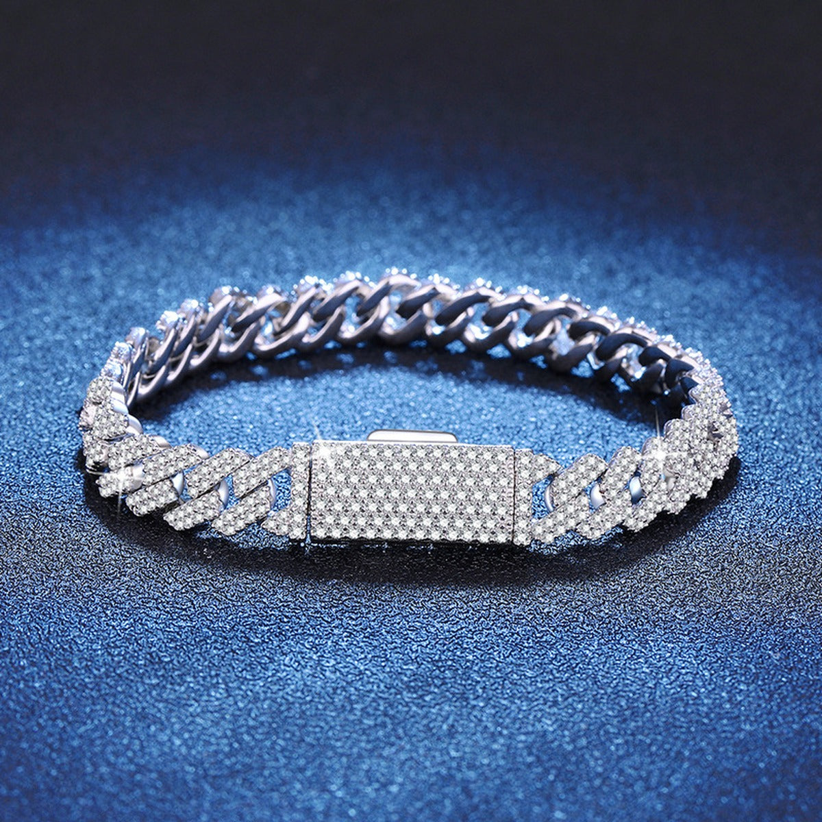 6mm Full Pave Moissanite Cuban Link Bracelet styled on blue display background showing moissanite sparkle and chain detail