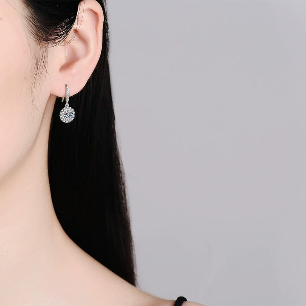 Round Halo Moissanite Drop Earrings with CZ in White Gold-Plated S925 worn on ear by model