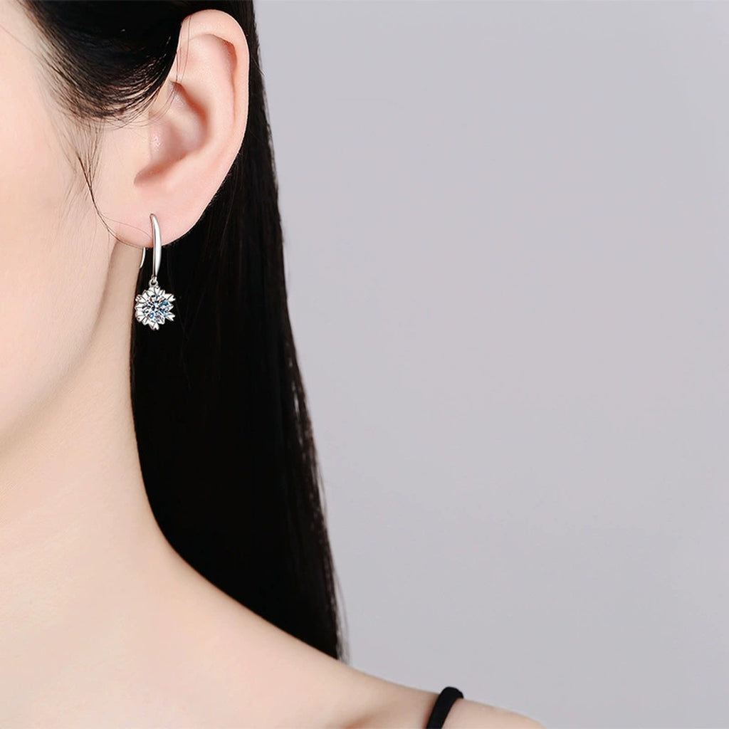Floral Moissanite Drop Earrings in White Gold-Plated S925 Silver worn on ear by model