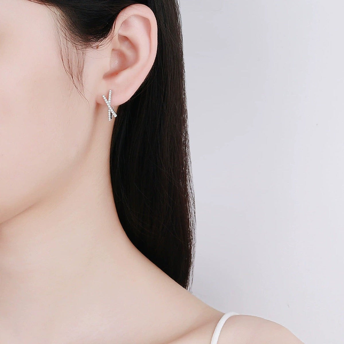 Cross Moissanite Hoop Earrings with CZ in White Gold-Plated S925 worn on ear by model