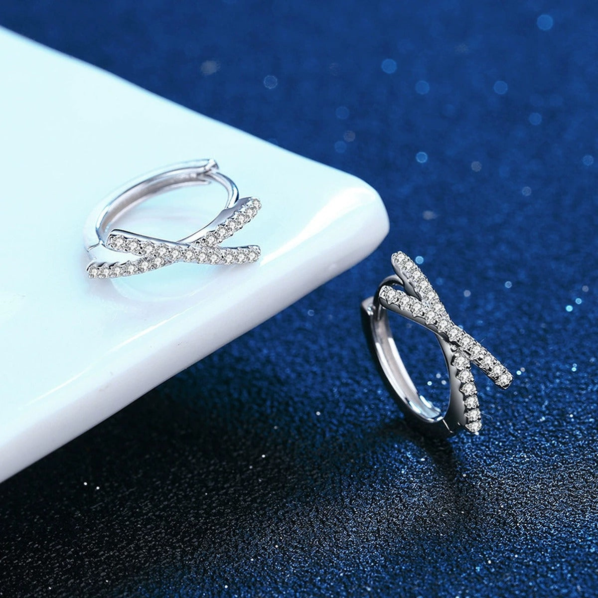 Cross Moissanite Hoop Earrings with CZ in White Gold-Plated S925 blue scene close-up view