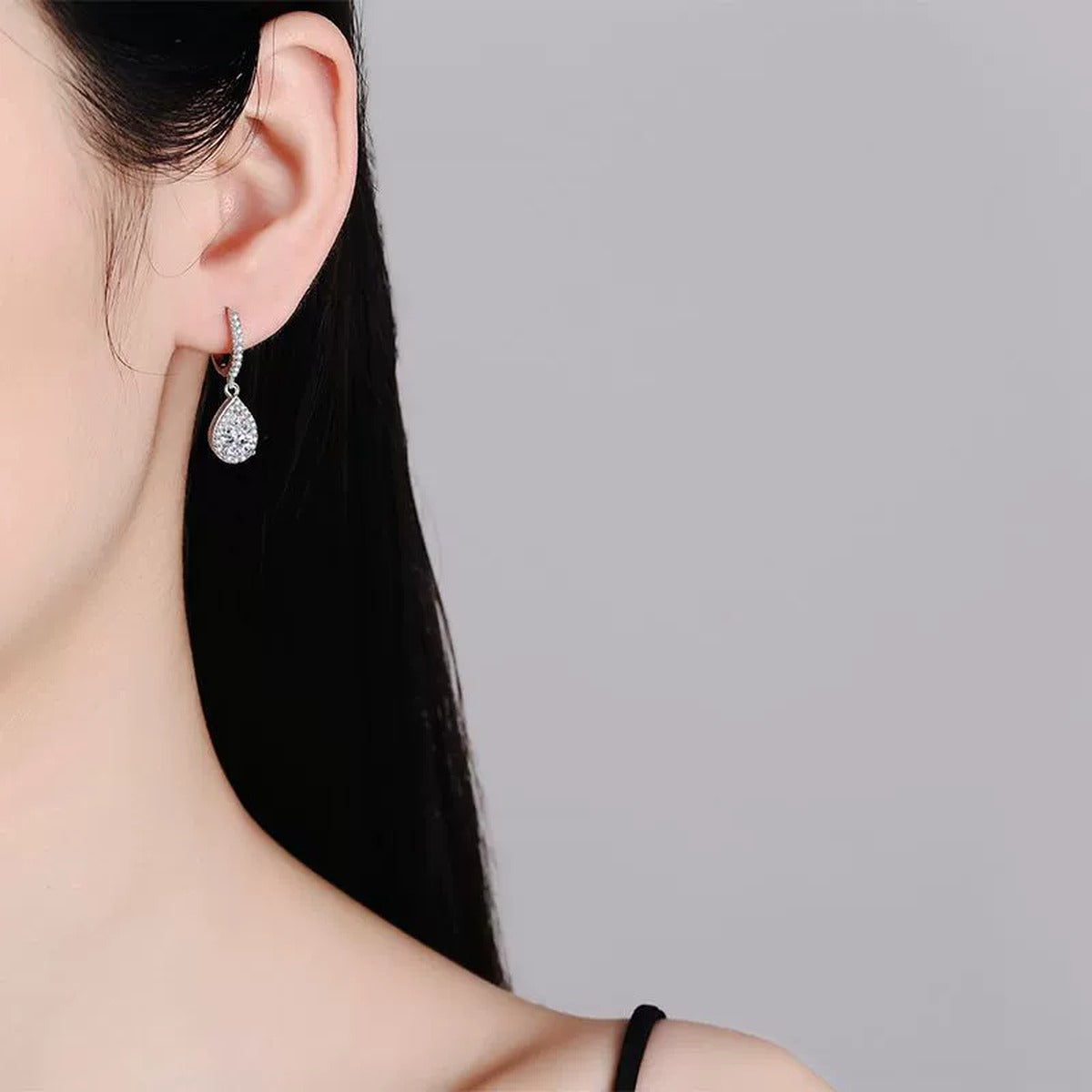 Pear Moissanite Hoop Drop Earrings with CZ in White Gold-Plated S925 worn on ear by model