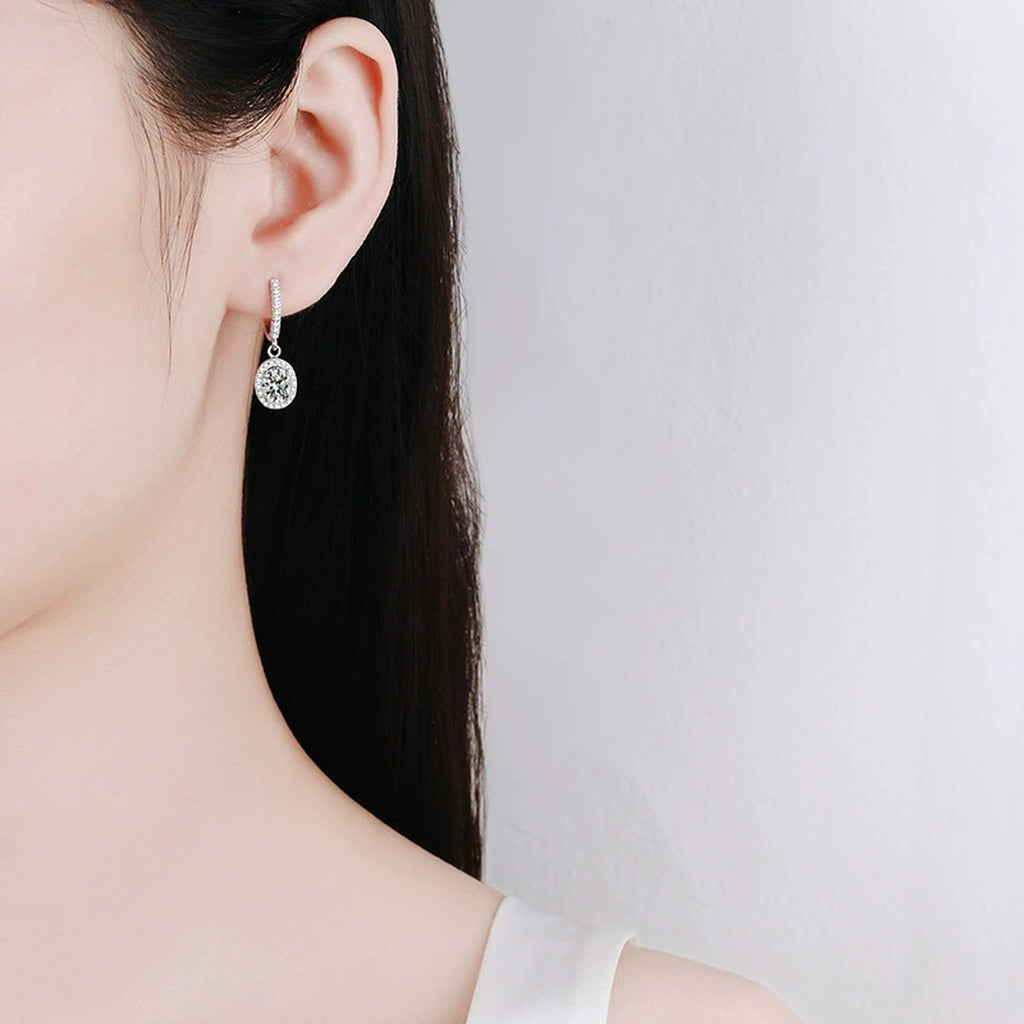 Oval Moissanite Hoop Drop Earrings with CZ in White Gold-Plated S925 worn on ear by model