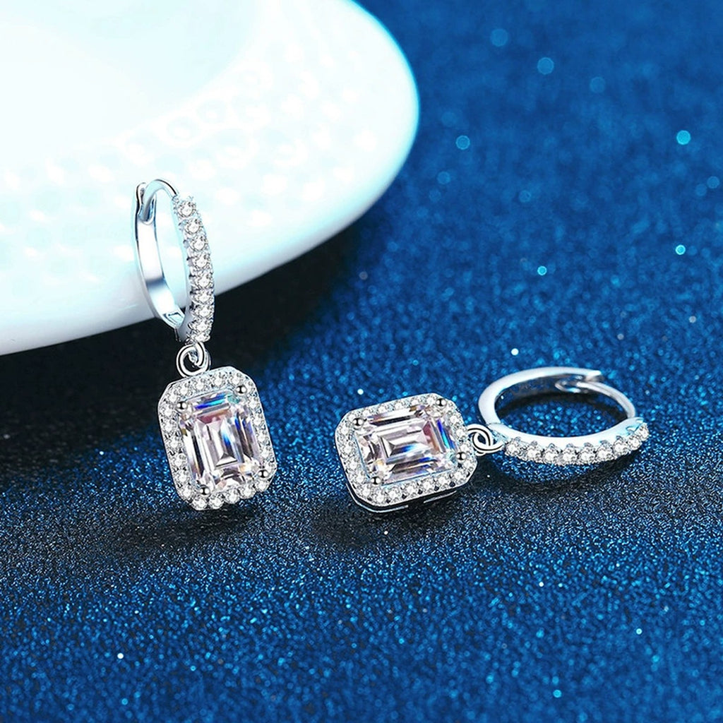 Radiant and Emerald Cut Moissanite Hoop Drop Earrings with CZ in S925 blue scene angled view