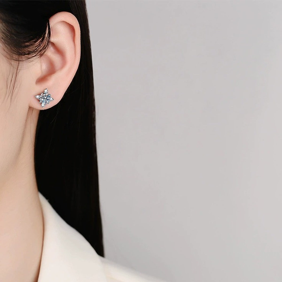 Four-Point Moissanite Stud Earrings with CZ in White Gold-Plated S925 worn on ear by model