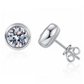 Bezel Moissanite Stud Earrings in White Gold-Plated S925 Sterling Silver on clean white background showing the pair and minimal round bezel stud earrings with smooth polished sides