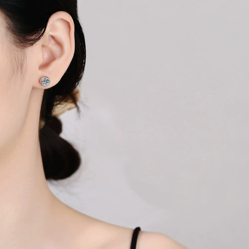 Bezel Moissanite Stud Earrings in White Gold-Plated S925 Sterling Silver worn on ear by model