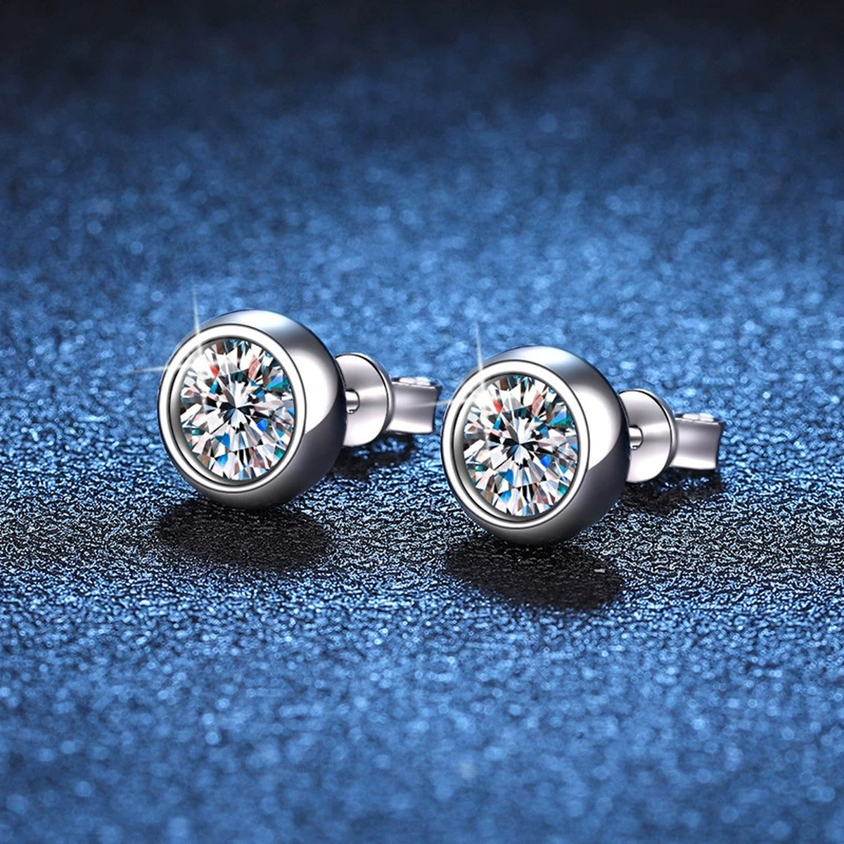 Bezel Moissanite Stud Earrings in White Gold-Plated S925 Sterling Silver blue scene angled view