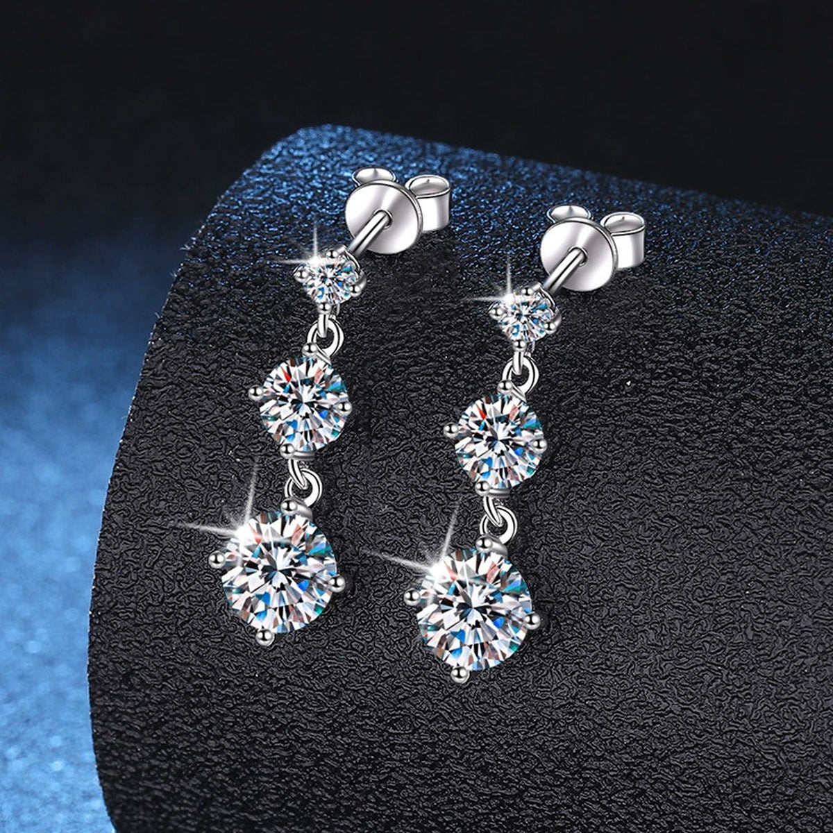 Graduated Moissanite Drop Earrings in White Gold-Plated S925 Sterling Silver dark background product display view