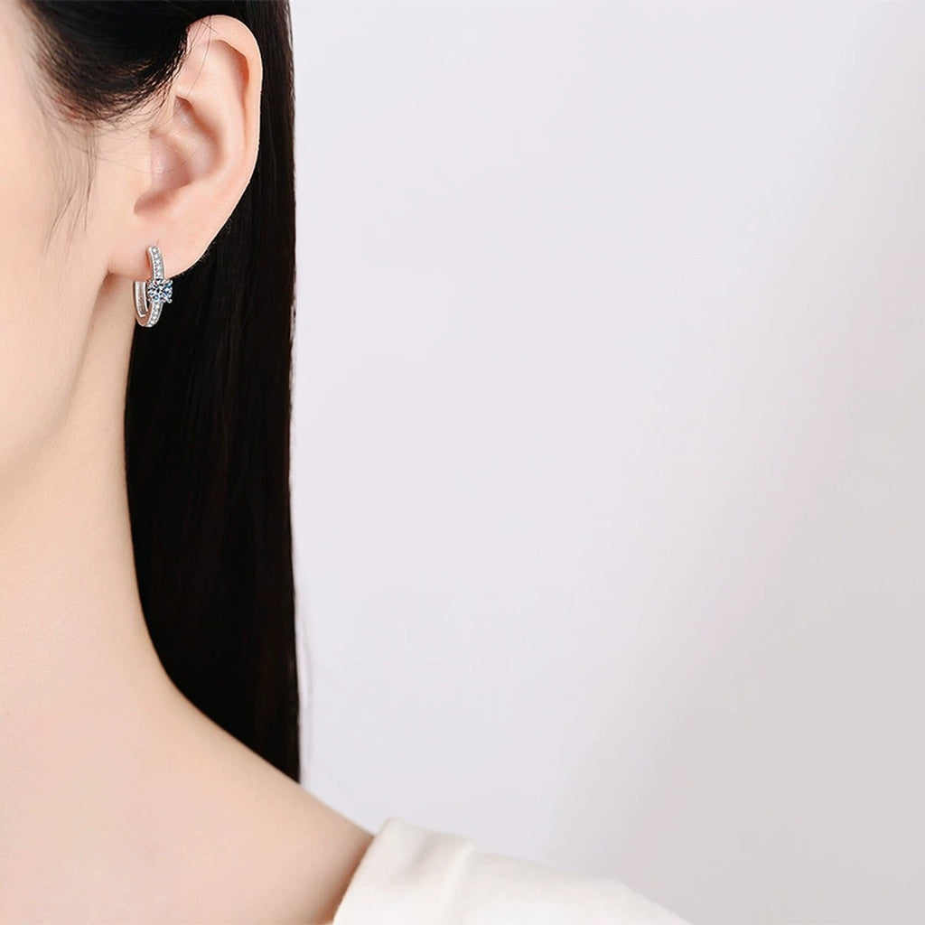 Round Halo Moissanite Huggie Hoop Earrings with CZ in White Gold-Plated S925 worn on ear by model