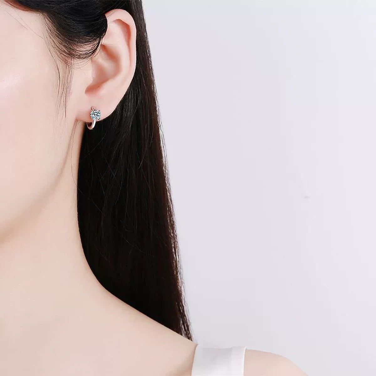 Floral Cluster Moissanite Hoop Earrings in White Gold-Plated S925 Silver worn on ear by model