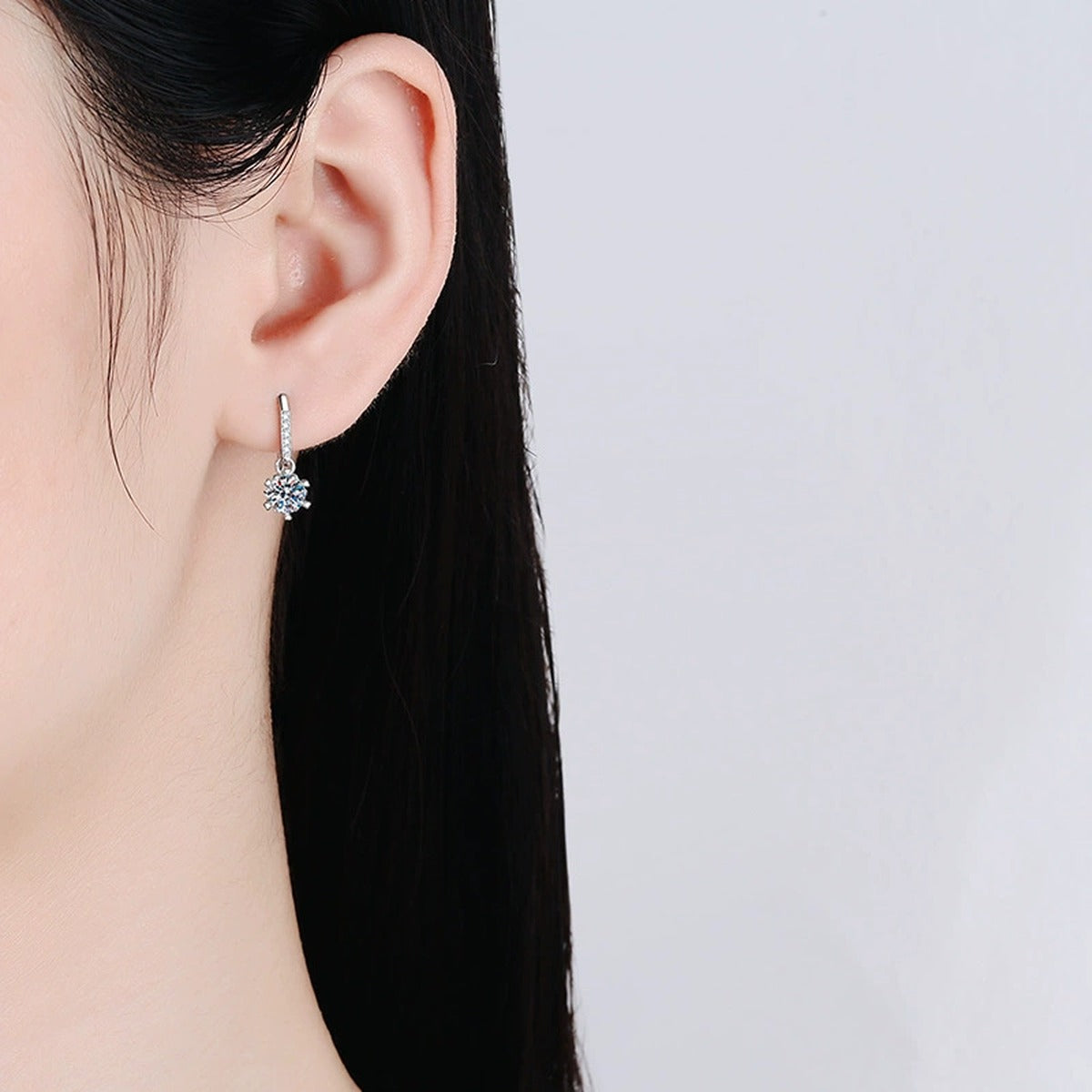 Floral Moissanite Drop Earrings with CZ in White Gold-Plated S925 worn on ear by model
