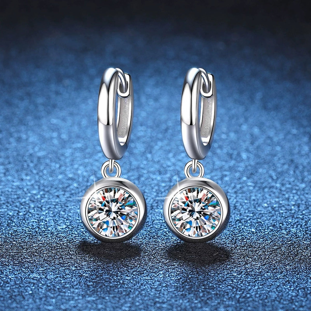 Round Moissanite Hoop Earrings in White Gold-Plated S925 Sterling Silver blue scene angled view