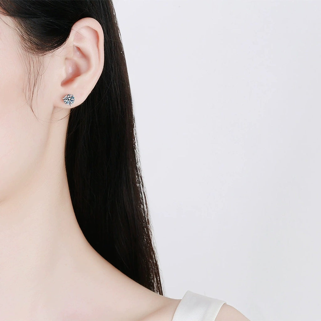 Round Moissanite Stud Earrings in White Gold-Plated S925 Sterling Silver worn on ear by model