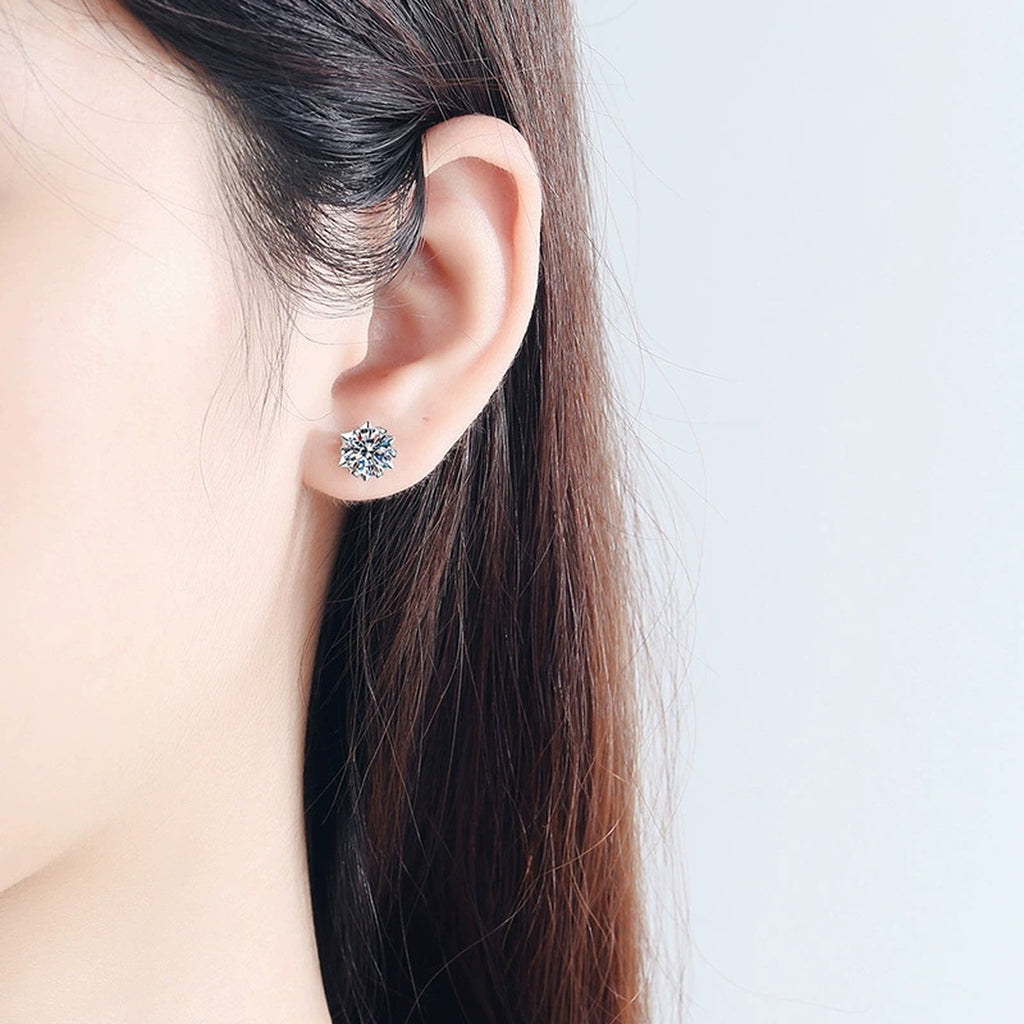 Round Four-Prong Moissanite Stud Earrings in White Gold-Plated S925 worn on ear by model