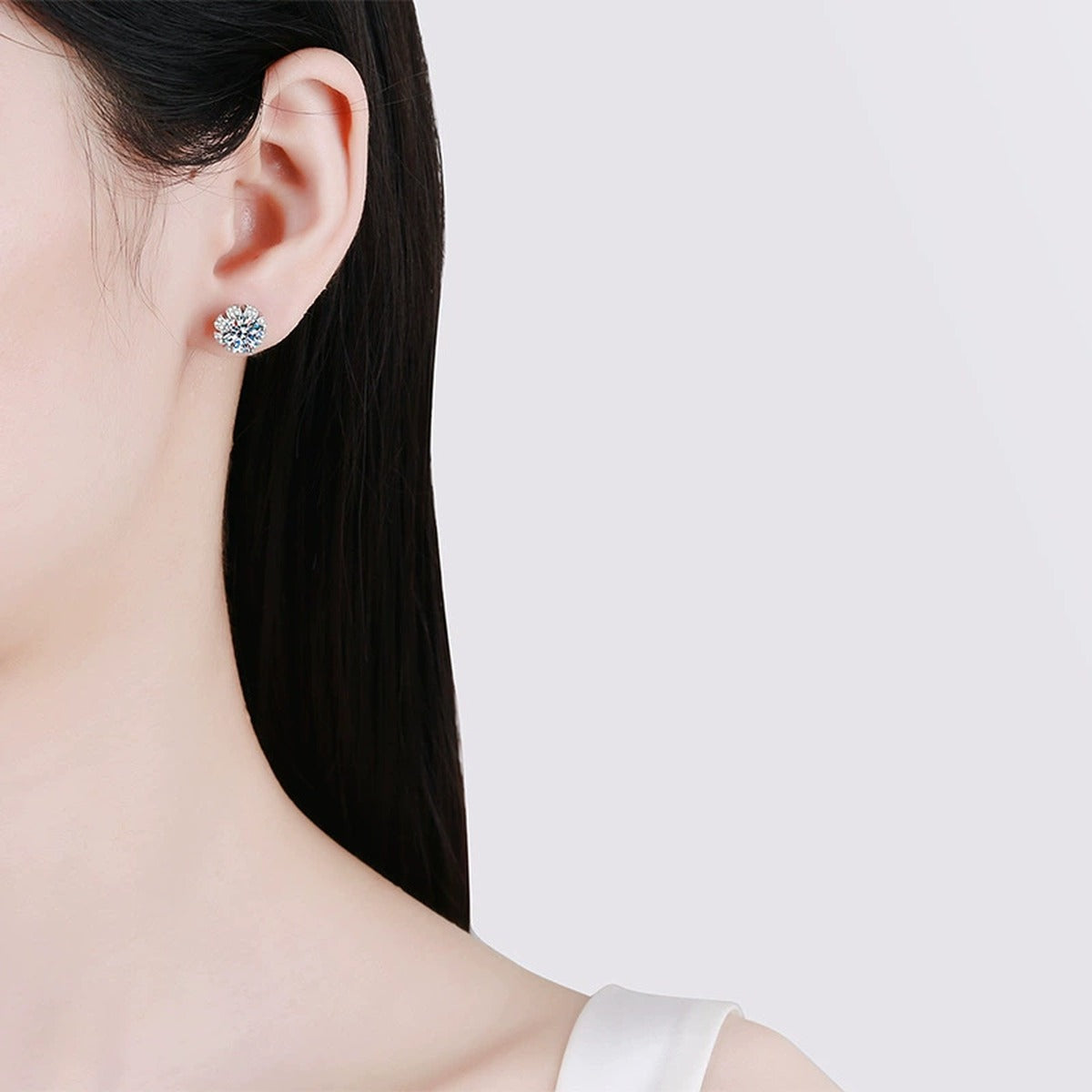 Round Floral Moissanite Stud Earrings in White Gold-Plated S925 Sterling Silver with CZ worn on ear by model