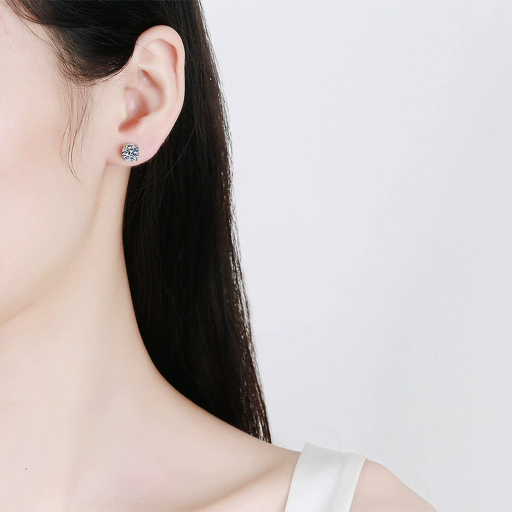 Round Moissanite Stud Earrings in White Gold-Plated S925 Sterling Silver worn on ear by model