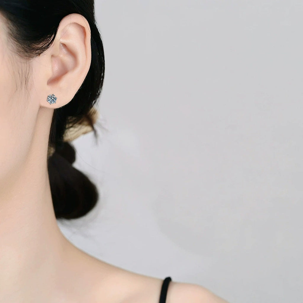 Round Moissanite Stud Earrings in White Gold-Plated S925 Sterling Silver worn on ear by model