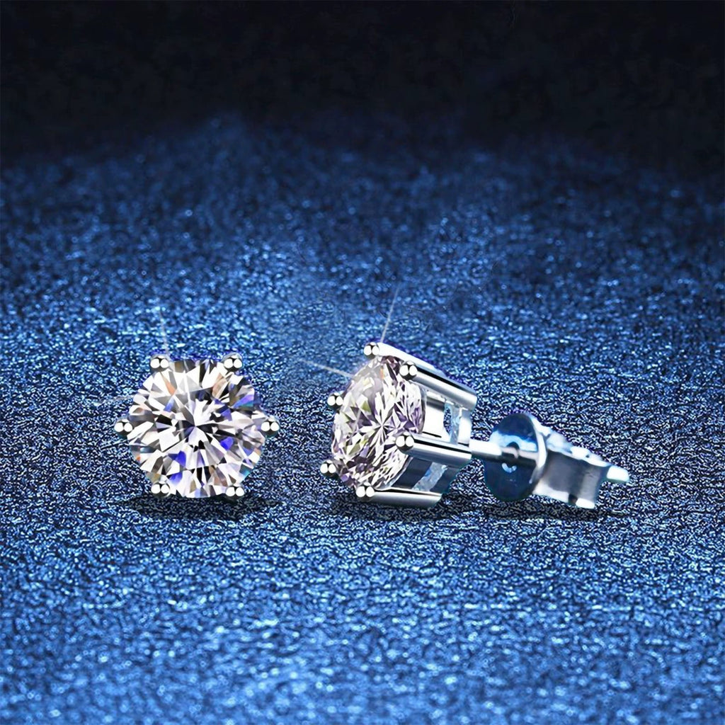 Round Moissanite Stud Earrings in White Gold-Plated S925 Sterling Silver blue scene angled view
