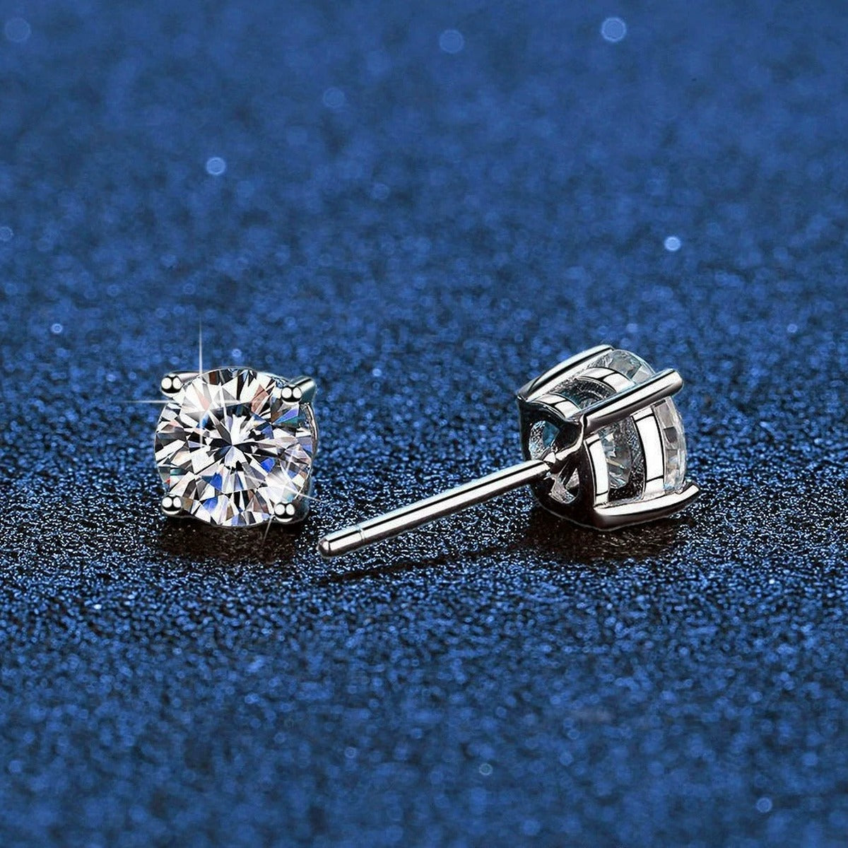 Round Moissanite Stud Earrings in White Gold-Plated S925 Sterling Silver blue scene close-up view