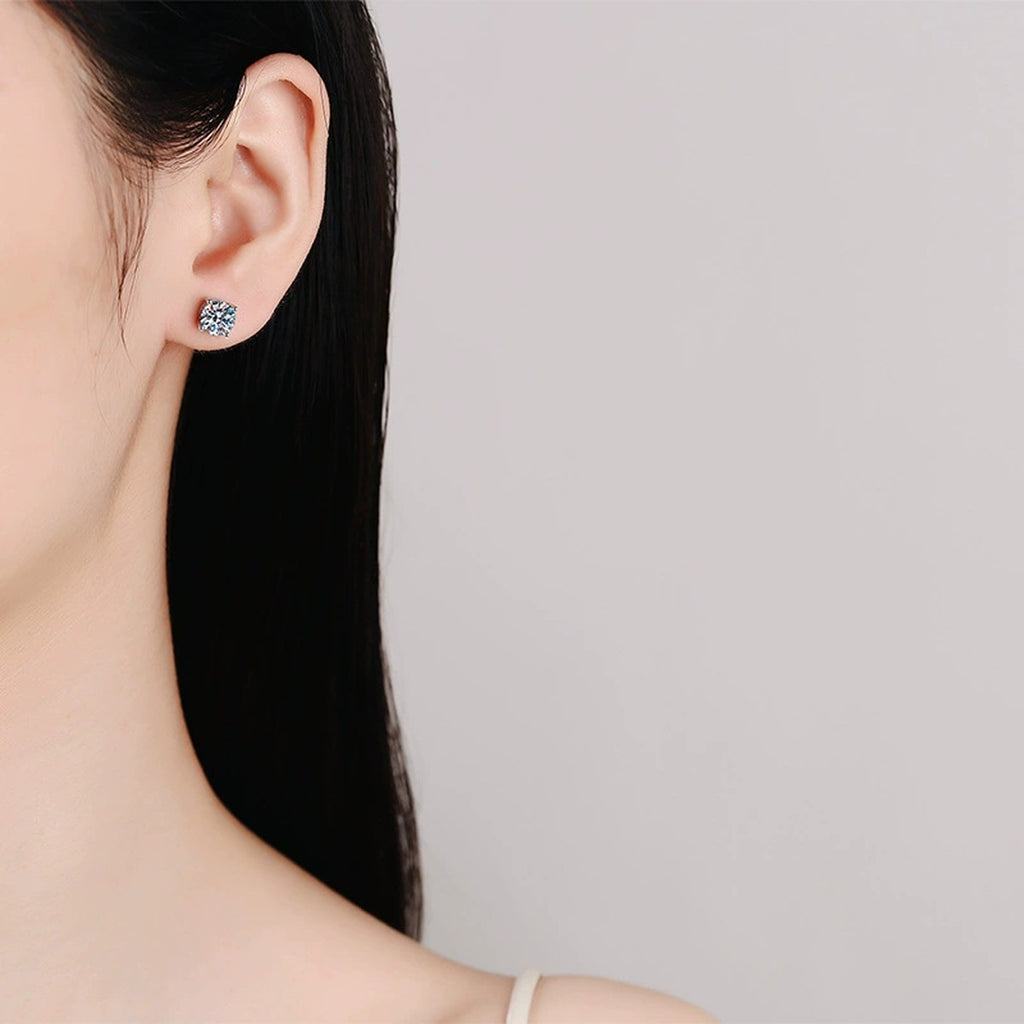 Round Moissanite Stud Earrings in White Gold-Plated S925 Sterling Silver worn on ear by model
