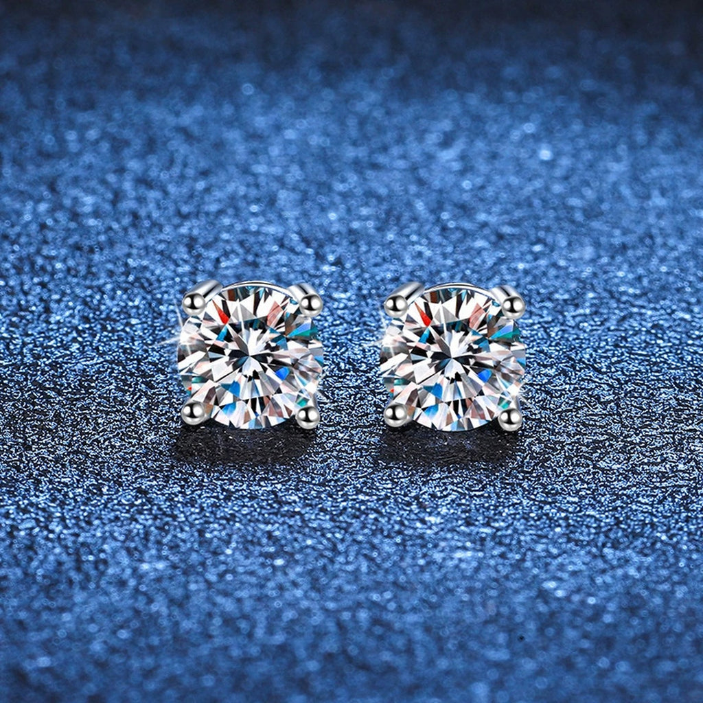 Round Moissanite Stud Earrings in White Gold-Plated S925 Sterling Silver blue scene close-up view