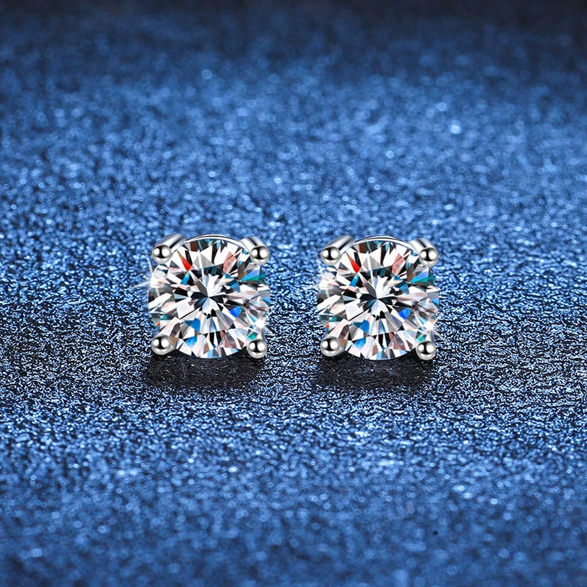 Round Moissanite Stud Earrings in White Gold-Plated S925 Sterling Silver blue scene close-up view